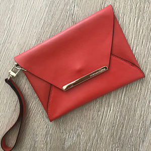 🍁 BCBGMAXAZRIA Orange Leather Wristlets